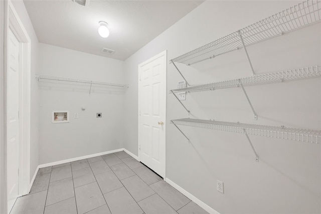 laundry room featuring laundry area, baseboards, gas dryer hookup, hookup for an electric dryer, and washer hookup