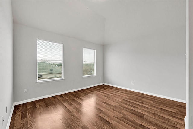 unfurnished room featuring wood finished floors and baseboards