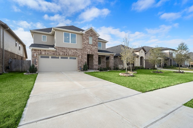 view of front of property with a garage, concrete driveway, fence, a front yard, and stucco siding