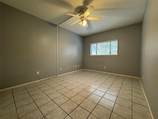 unfurnished room featuring a textured ceiling, baseboards, and a ceiling fan