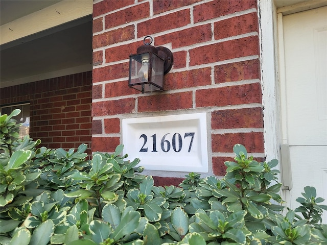 exterior details featuring brick siding