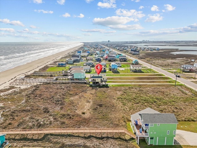 aerial view with a view of the beach and a water view