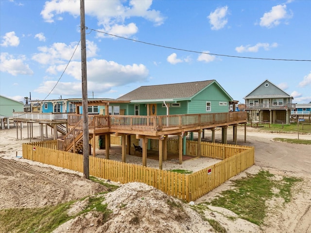 back of property with a fenced front yard