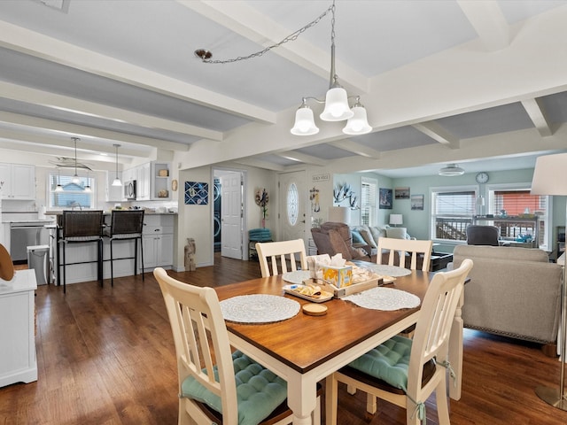 dining space featuring beamed ceiling, dark wood-type flooring, and a notable chandelier