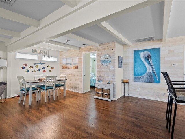 1103 White Cap Dr, Surfside Beach, TX 77541 - dining room with wood walls, beamed ceiling, and wood finished floors