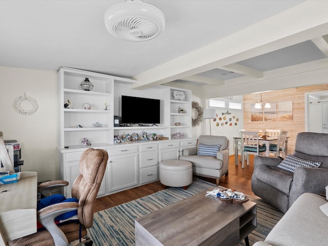 living room featuring dark wood-style floors, wood walls, beamed ceiling, and visible vents