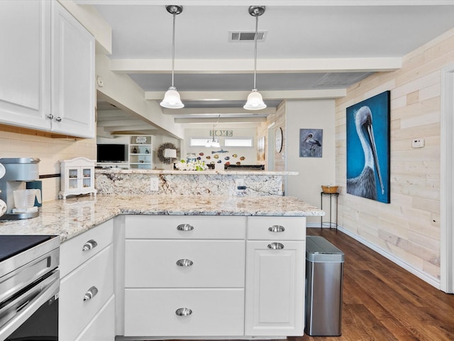 kitchen with a peninsula, white cabinetry, light stone countertops, beamed ceiling, and decorative light fixtures