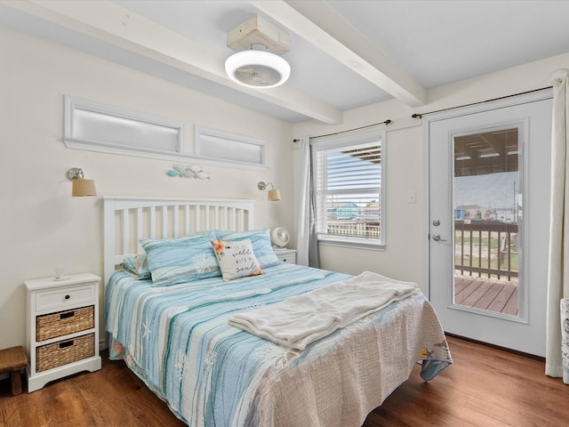 bedroom featuring access to outside, dark wood-type flooring, and beam ceiling