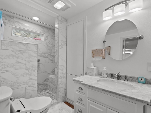 bathroom featuring visible vents, vanity, toilet, and walk in shower