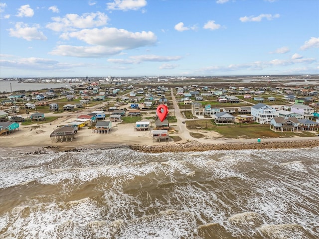 bird's eye view featuring a residential view, a water view, and a beach view