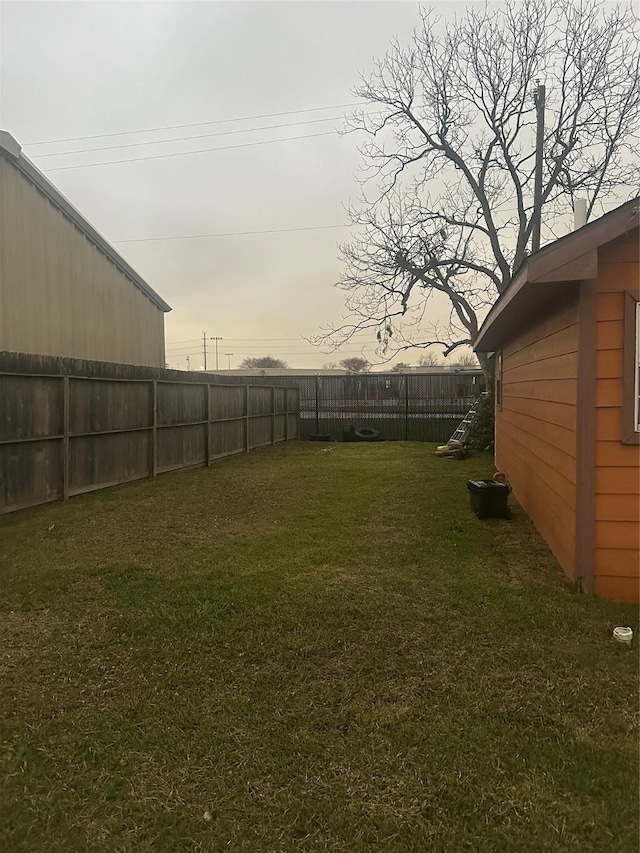 view of yard with a fenced backyard