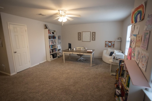 office with a ceiling fan, carpet, visible vents, and baseboards