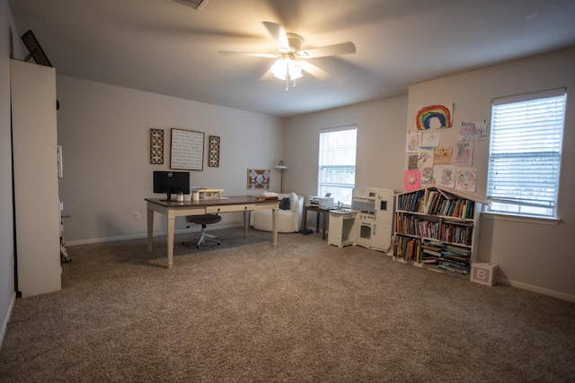 office area featuring carpet flooring, a ceiling fan, and baseboards