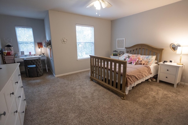 bedroom featuring light colored carpet, baseboards, and multiple windows