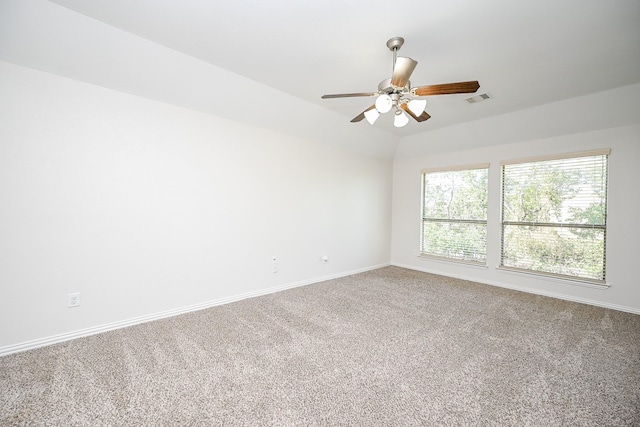 spare room featuring a ceiling fan, baseboards, visible vents, and carpet flooring