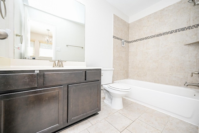 bathroom featuring toilet, vanity, tile patterned flooring, and bathing tub / shower combination