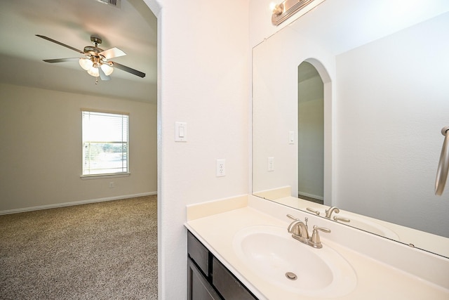 bathroom featuring baseboards, vanity, and a ceiling fan