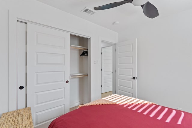 bedroom featuring a closet, visible vents, and ceiling fan