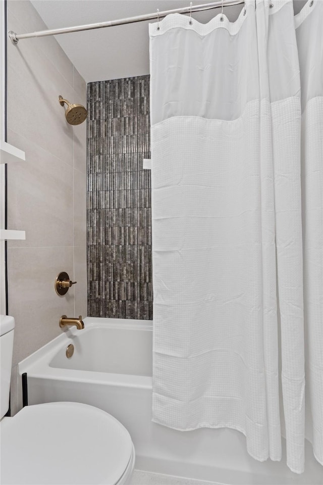 bathroom featuring toilet and shower / tub combo with curtain