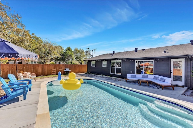 view of pool featuring fence, grilling area, a fenced in pool, and a patio