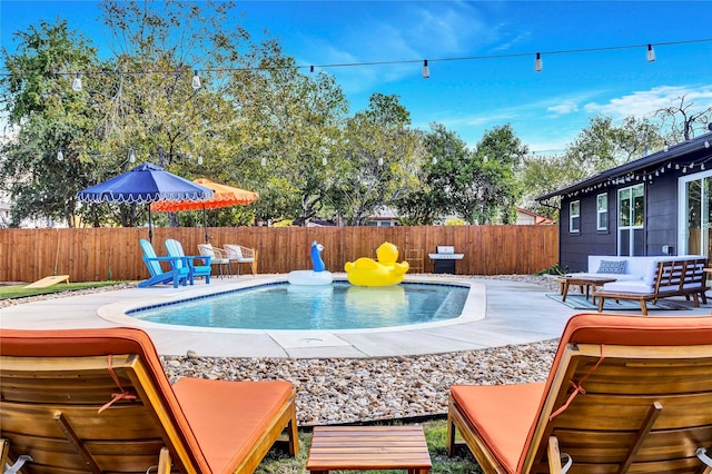 view of pool with a fenced backyard, a fenced in pool, and a patio