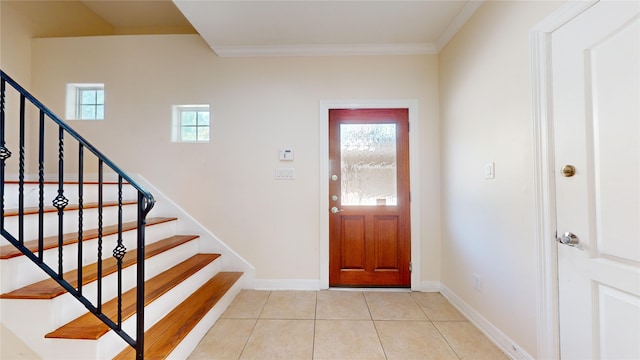 foyer entrance featuring plenty of natural light, stairway, and light tile patterned flooring