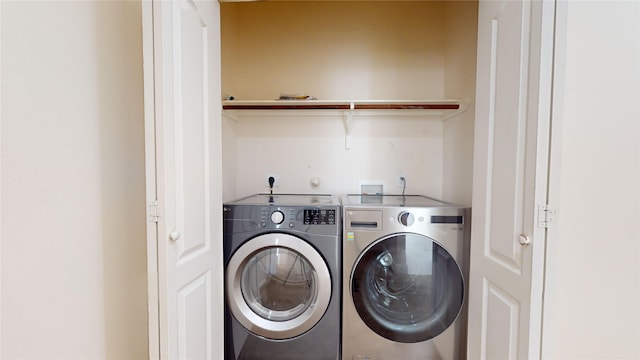 clothes washing area with laundry area and washing machine and dryer