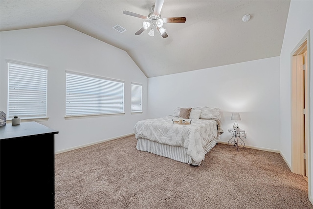 carpeted bedroom with a ceiling fan, lofted ceiling, visible vents, and baseboards