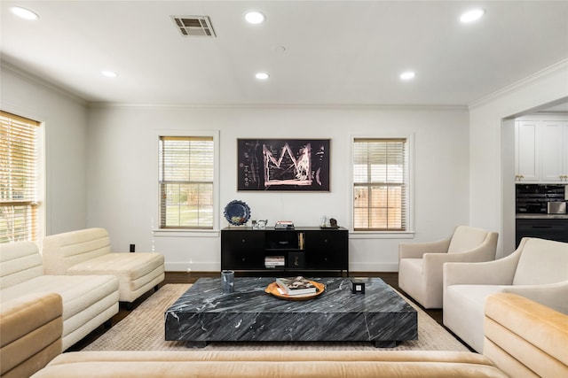 516 W 30th St, Houston, TX 77018 - living room featuring wood finished floors, baseboards, crown molding, healthy amount of natural light, and recessed lighting