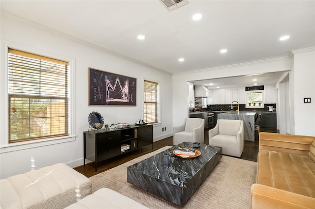 516 W 30th St, Houston, TX 77018 - living room with ornamental molding, recessed lighting, wood finished floors, and baseboards