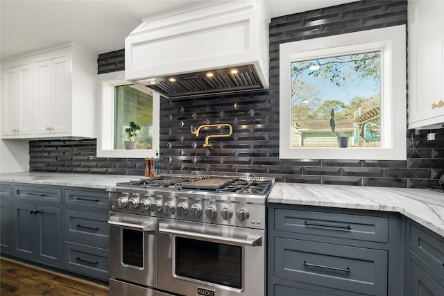 516 W 30th St, Houston, TX 77018 - kitchen featuring double oven range, custom range hood, decorative backsplash, white cabinetry, and light stone countertops