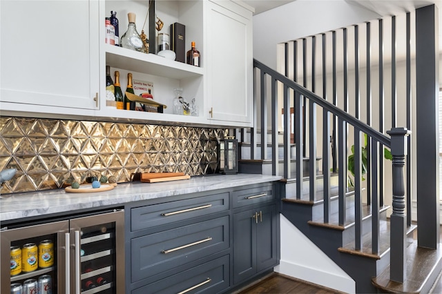 516 W 30th St, Houston, TX 77018 - indoor dry bar with wine cooler, decorative backsplash, stairway, and dark wood finished floors