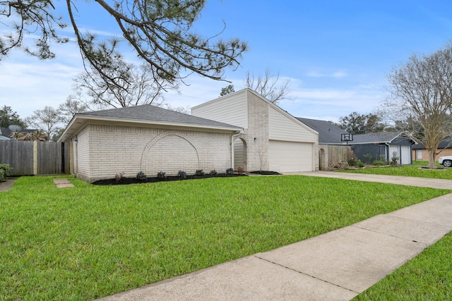 view of property exterior with concrete driveway, brick siding, a lawn, and fence