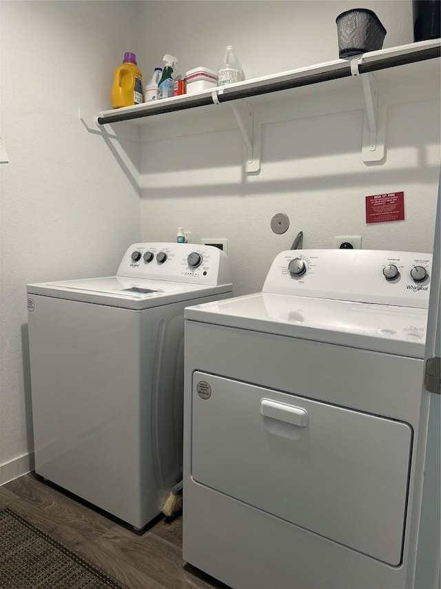 washroom with laundry area, dark wood-style flooring, and washing machine and dryer