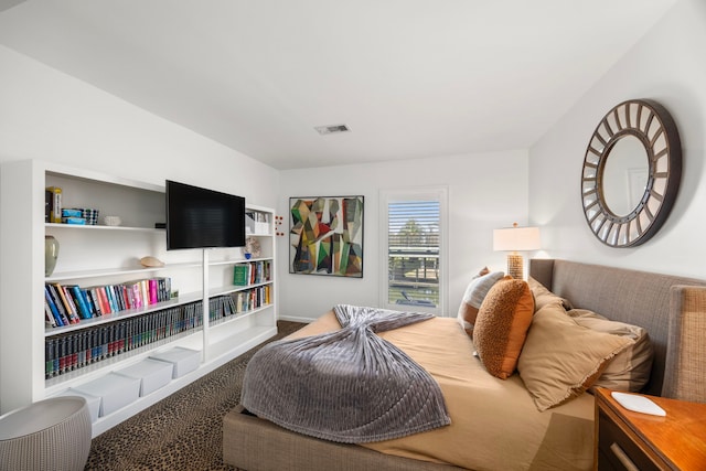 carpeted bedroom with visible vents