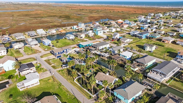 bird's eye view featuring a water view and a residential view