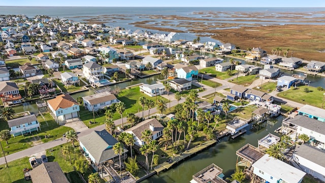 aerial view featuring a residential view and a water view