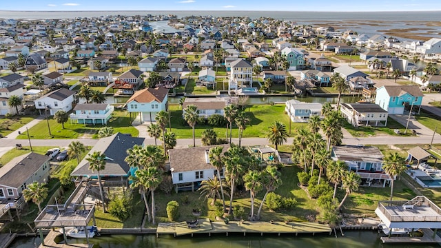 birds eye view of property with a residential view and a water view