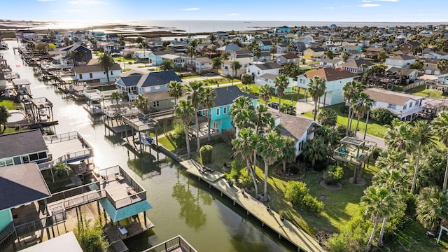 birds eye view of property with a residential view and a water view