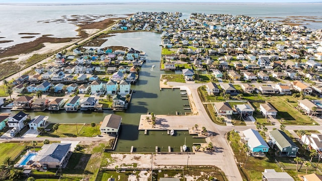 drone / aerial view with a water view and a residential view