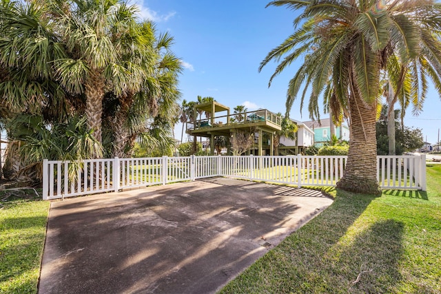 exterior space with a front yard and fence