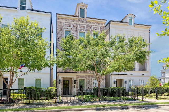 view of property featuring a fenced front yard