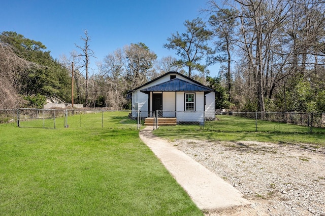 view of front of property with a fenced front yard, board and batten siding, and a front yard