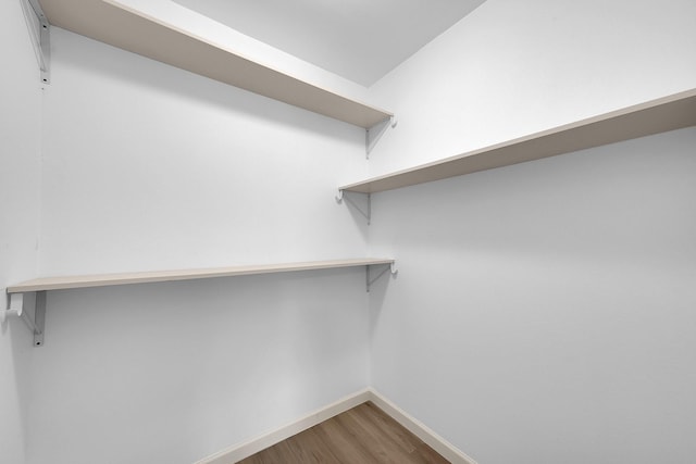 spacious closet with wood finished floors