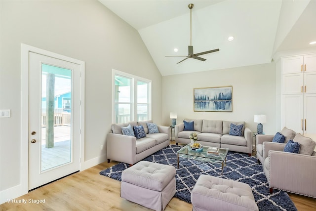 living area featuring recessed lighting, ceiling fan, high vaulted ceiling, light wood-type flooring, and baseboards