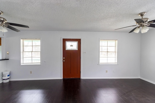 629 13th Ave N, Texas City, TX 77590 - entryway featuring a wealth of natural light, ceiling fan, baseboards, and dark wood-type flooring