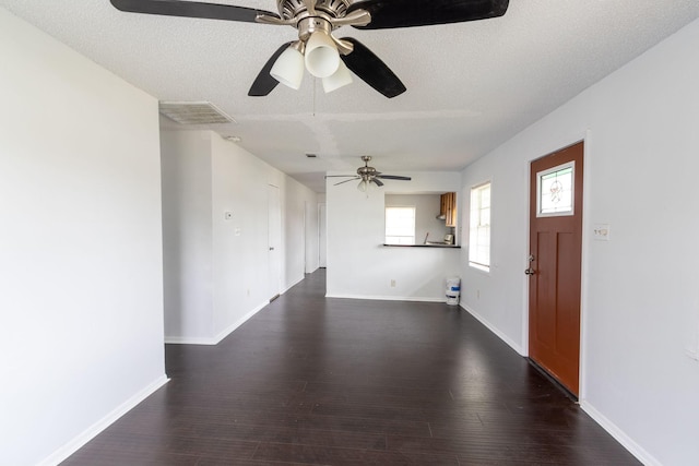 629 13th Ave N, Texas City, TX 77590 - interior space with dark wood-style floors, baseboards, visible vents, and a textured ceiling