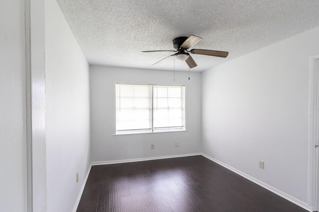 629 13th Ave N, Texas City, TX 77590 - spare room featuring a textured ceiling, dark wood-type flooring, a ceiling fan, and baseboards