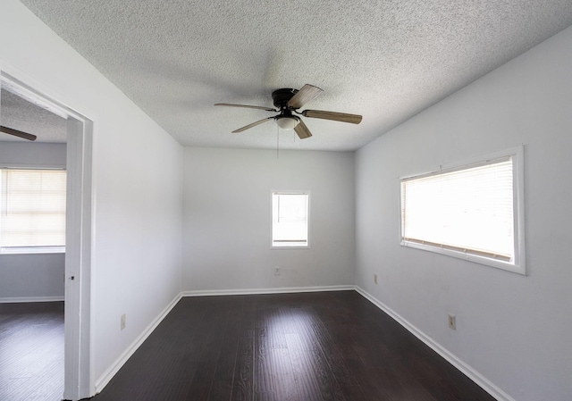629 13th Ave N, Texas City, TX 77590 - empty room with dark wood-style floors, ceiling fan, a textured ceiling, and baseboards