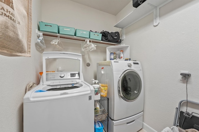 laundry room with laundry area and separate washer and dryer